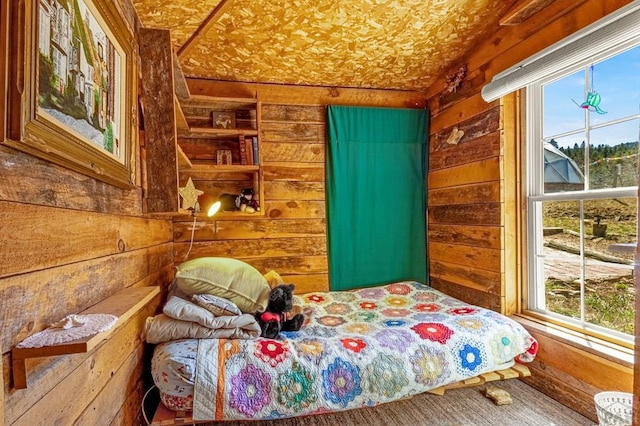 8929 Apache Dr, Beulah, CO 81023 - bedroom with wood walls