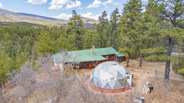 8929 Apache Dr, Beulah, CO 81023 - aerial view of property and surrounding area with a heavily wooded area and mountains