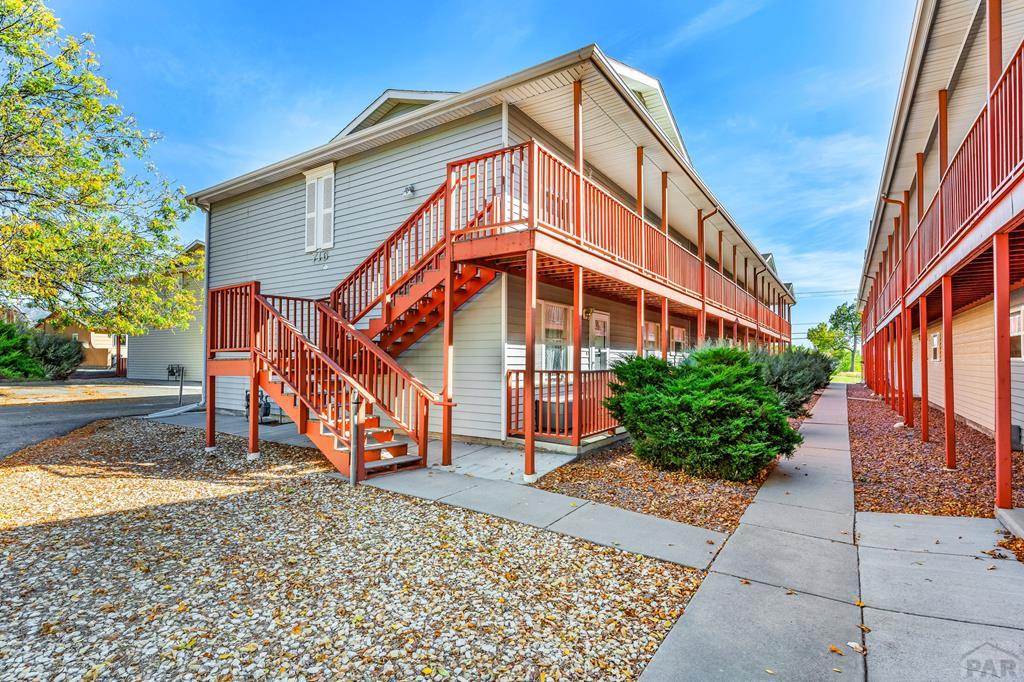 exterior space featuring stairway and a wooden deck