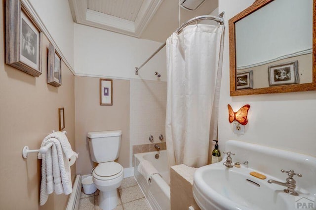 314 S Main St, La Veta, CO 81055 - full bathroom with baseboards, toilet, ornamental molding, shower / bath combination with curtain, and a sink