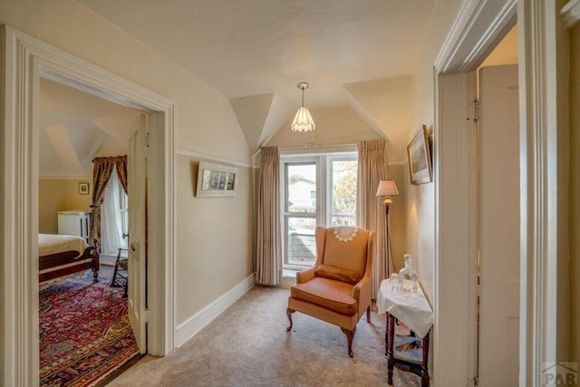 314 S Main St, La Veta, CO 81055 - sitting room featuring vaulted ceiling, radiator, baseboards, and light colored carpet