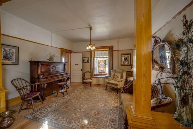 314 S Main St, La Veta, CO 81055 - sitting room featuring a chandelier and wood finished floors