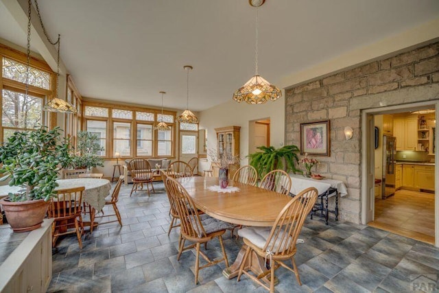 314 S Main St, La Veta, CO 81055 - dining room featuring stone finish floor and a wealth of natural light