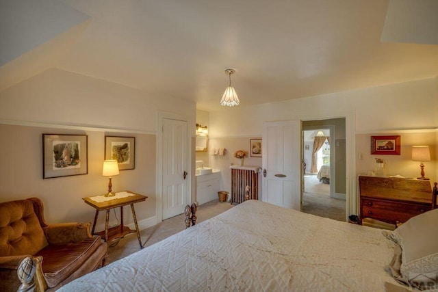 314 S Main St, La Veta, CO 81055 - carpeted bedroom with ensuite bath and baseboards