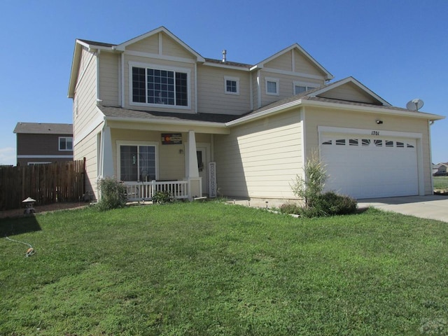 view of front of home featuring an attached garage, covered porch, fence, driveway, and a front yard