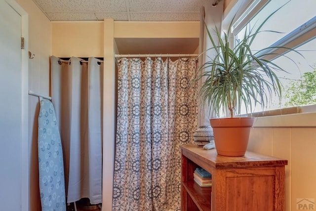 bathroom featuring a paneled ceiling