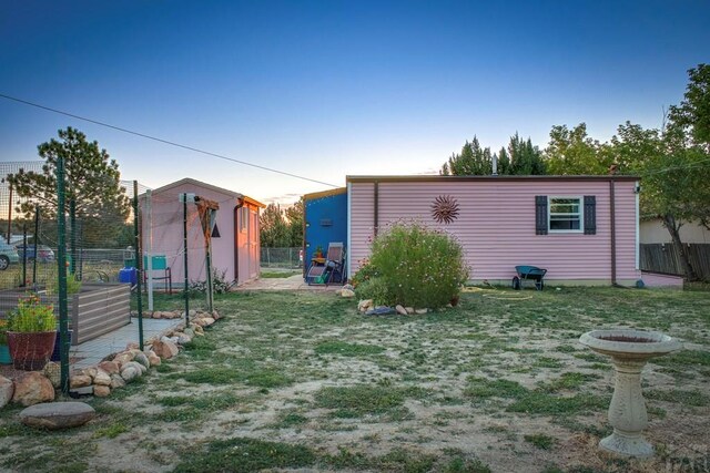 exterior space featuring fence and a yard