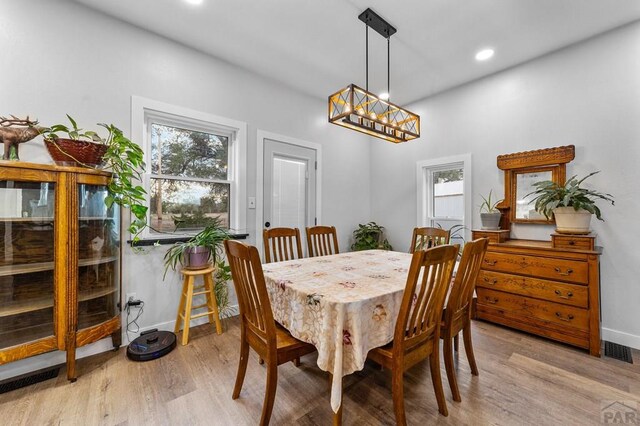 dining room with recessed lighting, light wood-type flooring, visible vents, and baseboards