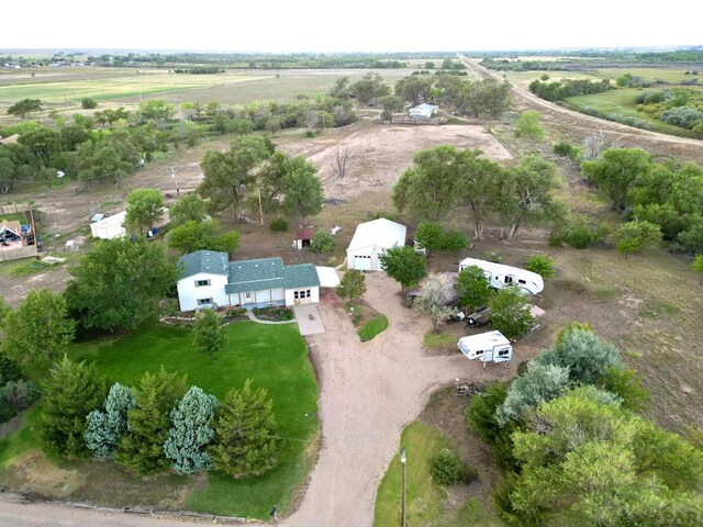 birds eye view of property with a rural view