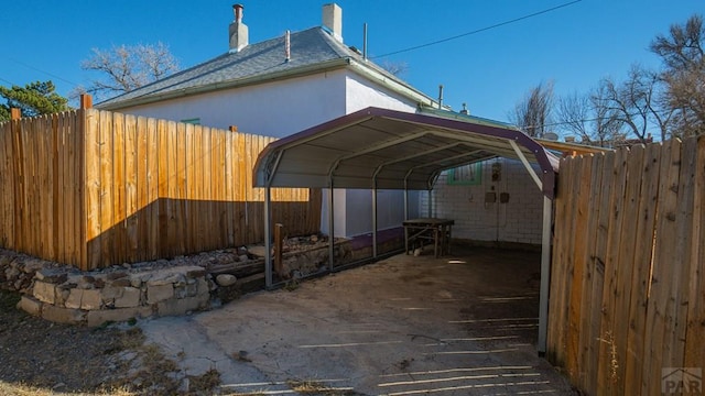 509 Walsen Ave, Walsenburg, CO 81089 - view of parking featuring fence and a carport