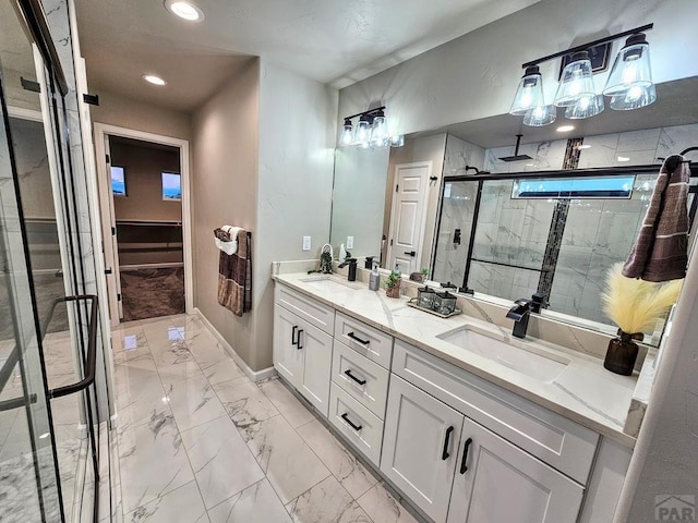 full bath with recessed lighting, a sink, marble finish floor, a shower stall, and double vanity