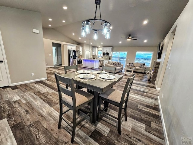 dining area with lofted ceiling, recessed lighting, baseboards, and wood finished floors