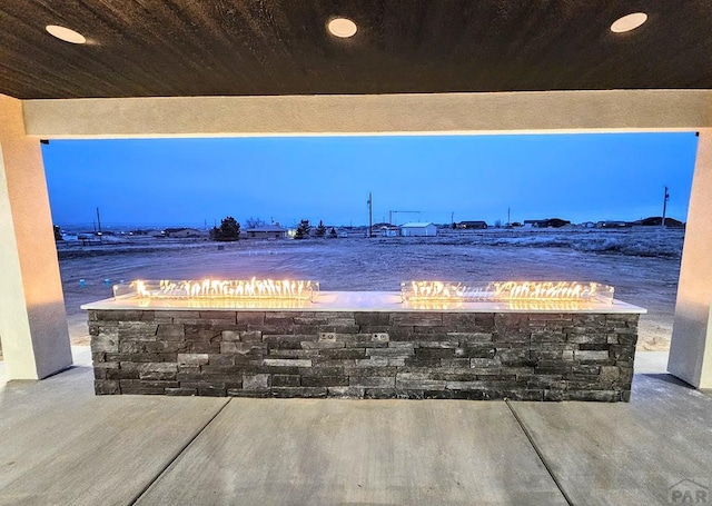 patio terrace at dusk with a fire pit