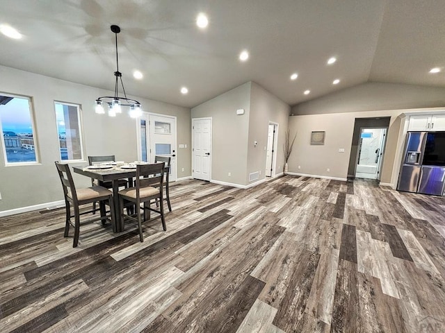 dining room featuring lofted ceiling, recessed lighting, wood finished floors, visible vents, and baseboards