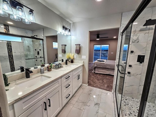 bathroom featuring a sink, marble finish floor, double vanity, and ensuite bath