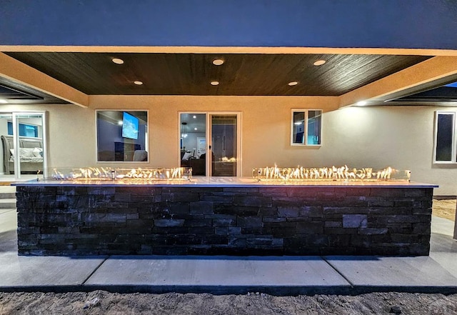 view of patio featuring an outdoor fire pit