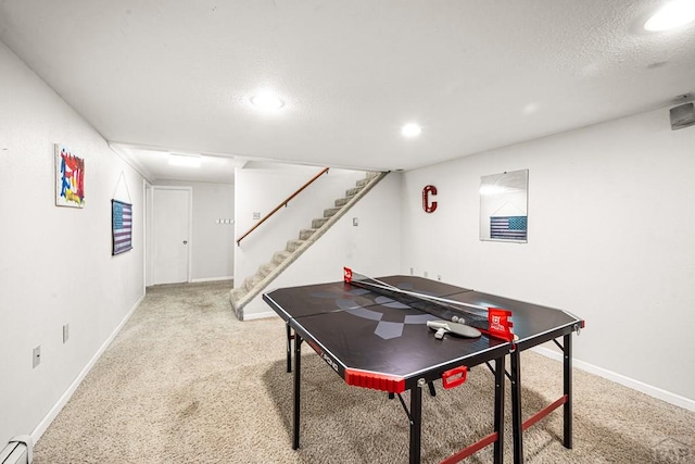67 Macarthur Rd, Pueblo, CO 81001 - playroom with carpet floors, a baseboard heating unit, a textured ceiling, and recessed lighting