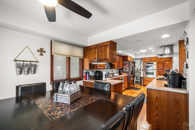 67 Macarthur Rd, Pueblo, CO 81001 - dining space with a ceiling fan, a raised ceiling, recessed lighting, and light wood finished floors