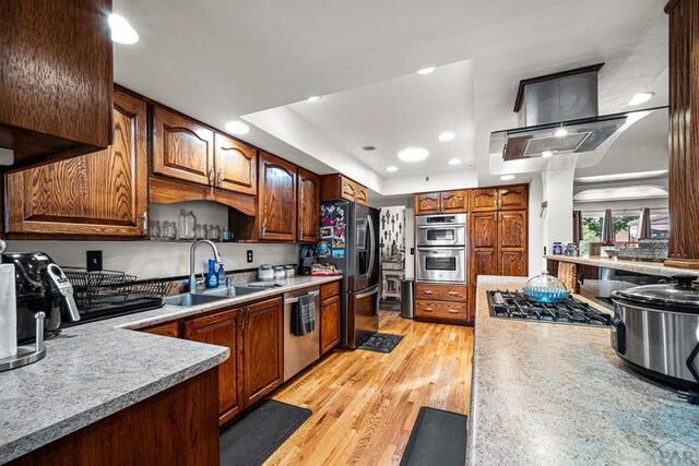 67 Macarthur Rd, Pueblo, CO 81001 - kitchen with light countertops, appliances with stainless steel finishes, a tray ceiling, and recessed lighting