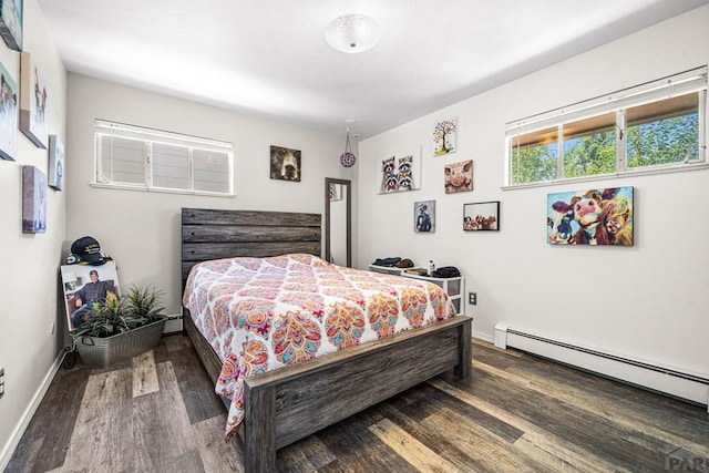 67 Macarthur Rd, Pueblo, CO 81001 - bedroom featuring a baseboard heating unit and wood finished floors