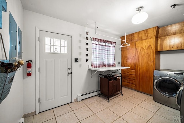 67 Macarthur Rd, Pueblo, CO 81001 - washroom with cabinet space, washer / dryer, light tile patterned floors, and a baseboard radiator