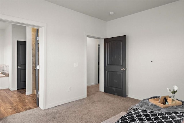 bedroom with baseboards and carpet flooring