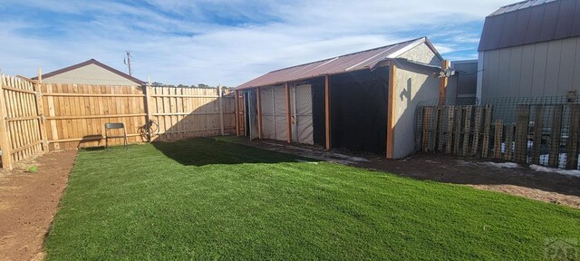 view of outbuilding with a fenced backyard