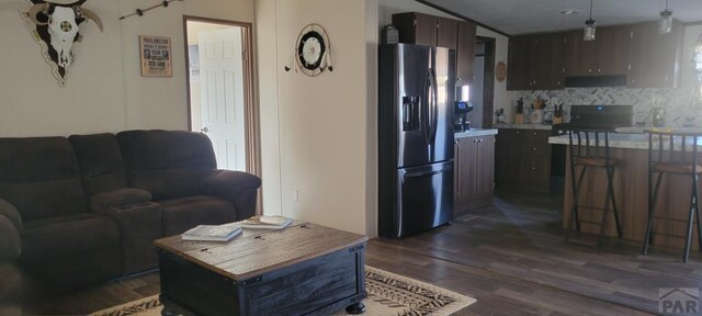 living area with dark wood-style floors