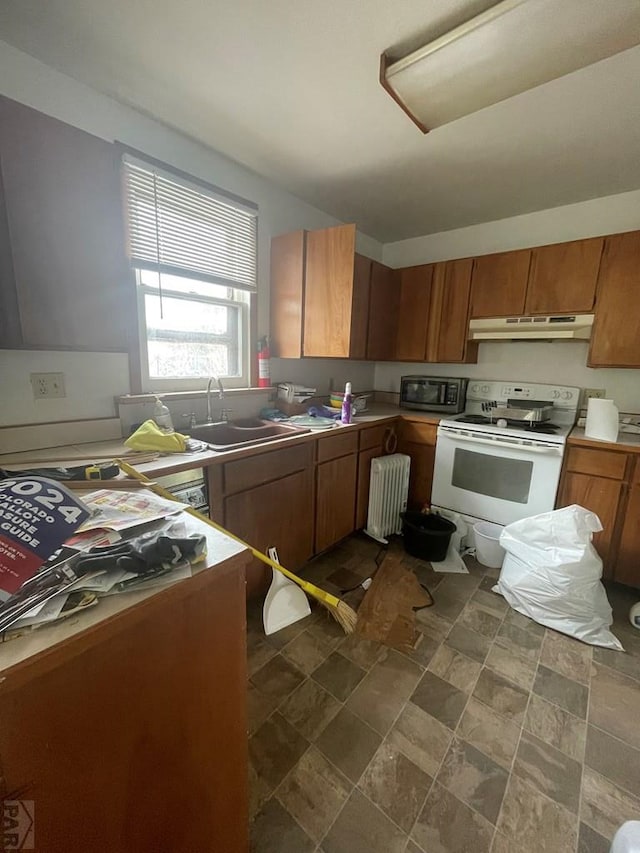 kitchen featuring brown cabinets, white electric range, radiator heating unit, a sink, and under cabinet range hood