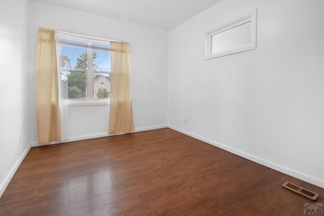 1142 Elm St, Pueblo, CO 81004 - unfurnished room featuring wood finished floors and baseboards