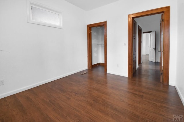 1142 Elm St, Pueblo, CO 81004 - empty room with dark wood-type flooring