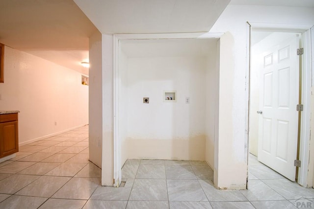 1142 Elm St, Pueblo, CO 81004 - laundry area with hookup for an electric dryer, washer hookup, and light tile patterned floors