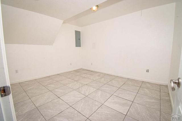 1142 Elm St, Pueblo, CO 81004 - bonus room featuring electric panel, vaulted ceiling, and light tile patterned flooring