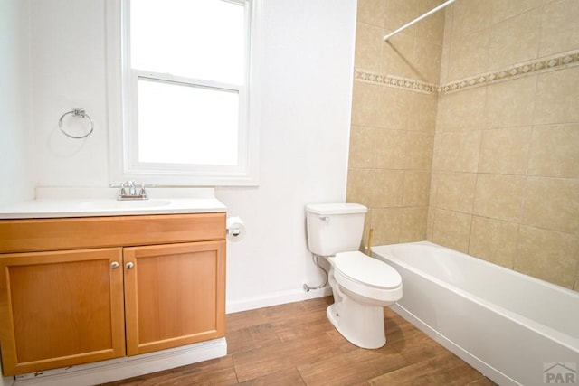 1142 Elm St, Pueblo, CO 81004 - bathroom with vanity, wood finished floors, and shower / bath combination