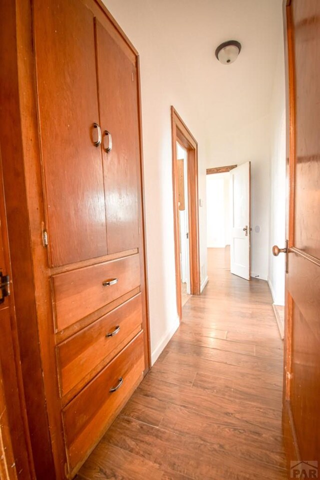 1142 Elm St, Pueblo, CO 81004 - hall with wood finished floors and baseboards