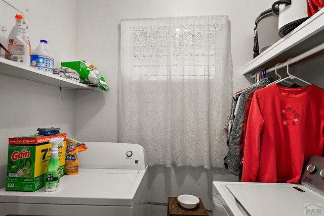 clothes washing area with laundry area and washing machine and clothes dryer