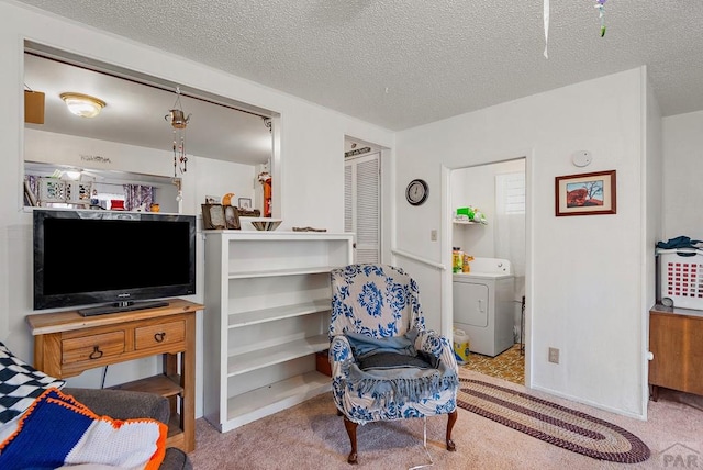 2306 Cortez Rd, Pueblo, CO 81003 - living area with light carpet, washer / clothes dryer, and a textured ceiling