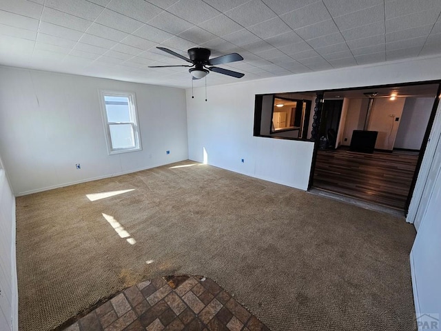 unfurnished room featuring carpet and ceiling fan