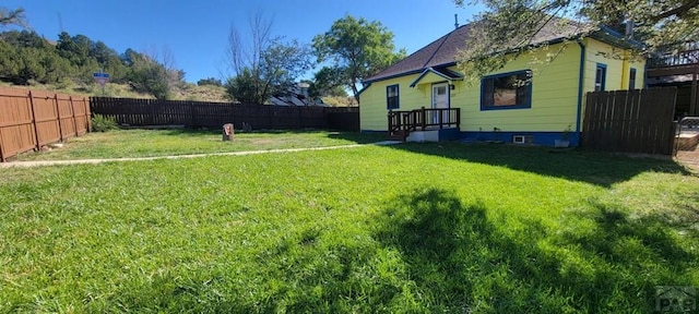 view of yard with a fenced backyard