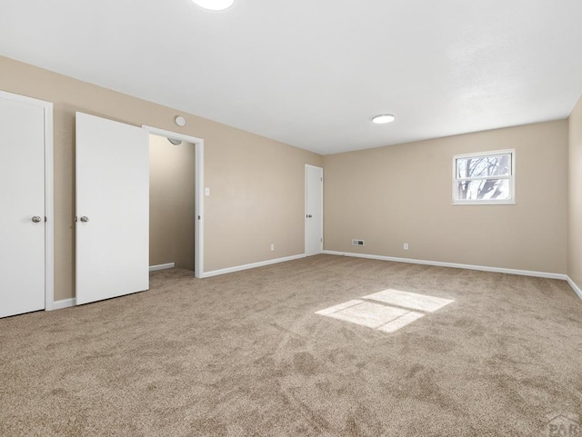 760 Crystal Ln, Pueblo, CO 81006 - interior space with light colored carpet and baseboards