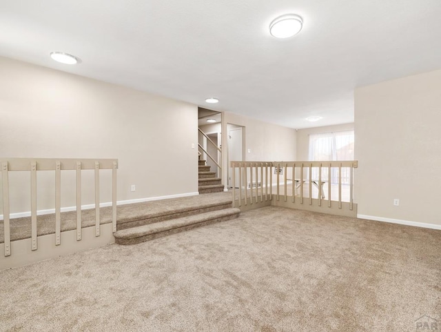 760 Crystal Ln, Pueblo, CO 81006 - carpeted empty room featuring stairway and baseboards