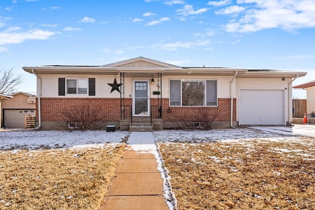 view of front of home featuring an attached garage, concrete driveway, and brick siding