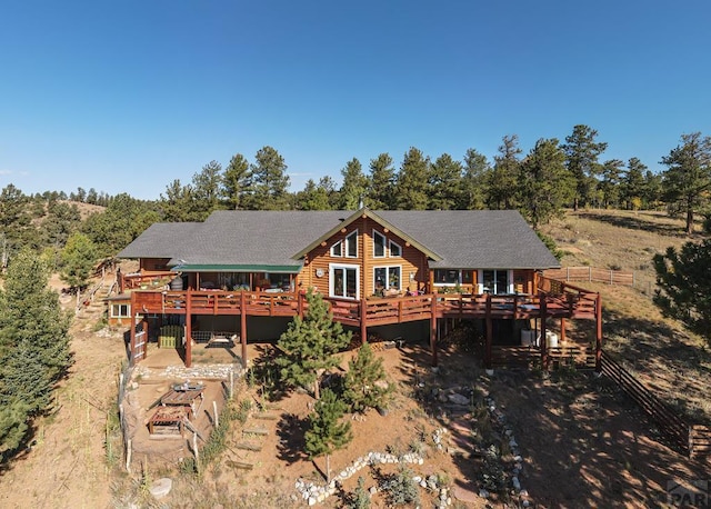 361 Crystal Peak Rd, Florissant, CO 80814 - rear view of house featuring log exterior and a wooden deck