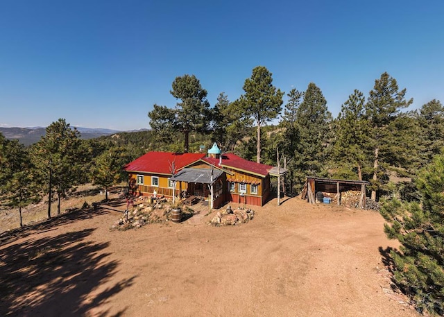 361 Crystal Peak Rd, Florissant, CO 80814 - exterior space featuring an outdoor structure, driveway, and exterior structure
