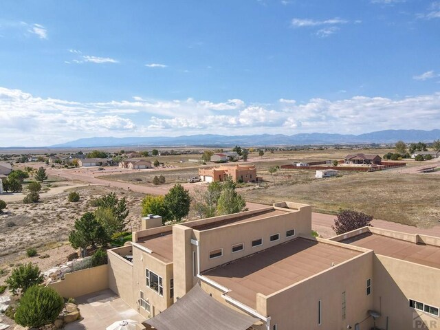 birds eye view of property featuring a mountain view