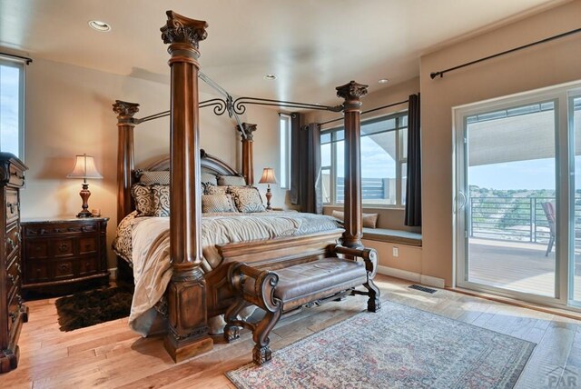 bedroom with access to outside, recessed lighting, visible vents, and light wood-style floors