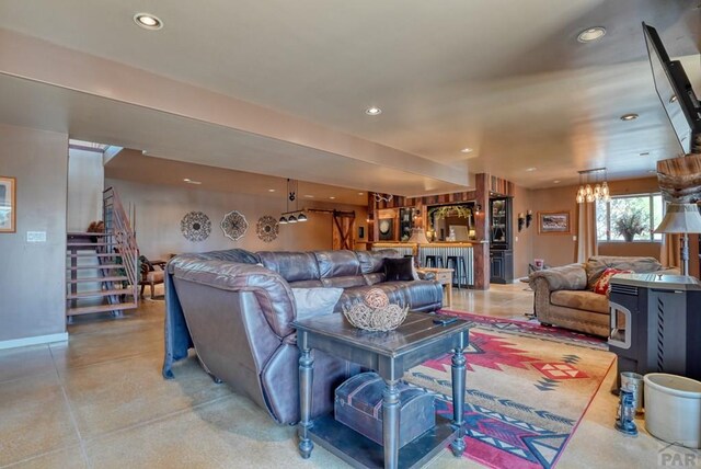 living room with stairs, baseboards, and recessed lighting