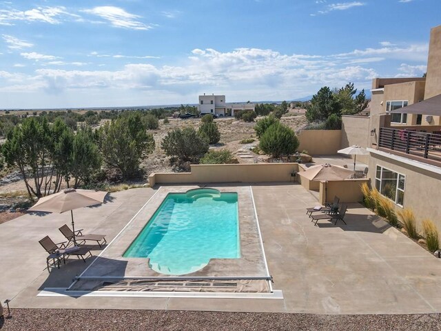 pool featuring a patio area