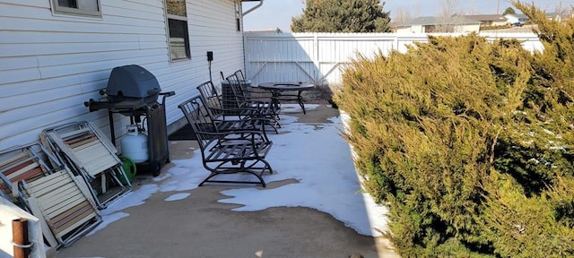 view of patio featuring fence and area for grilling