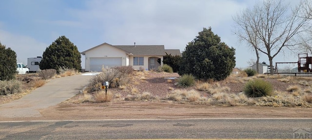 view of front of home with a garage and driveway